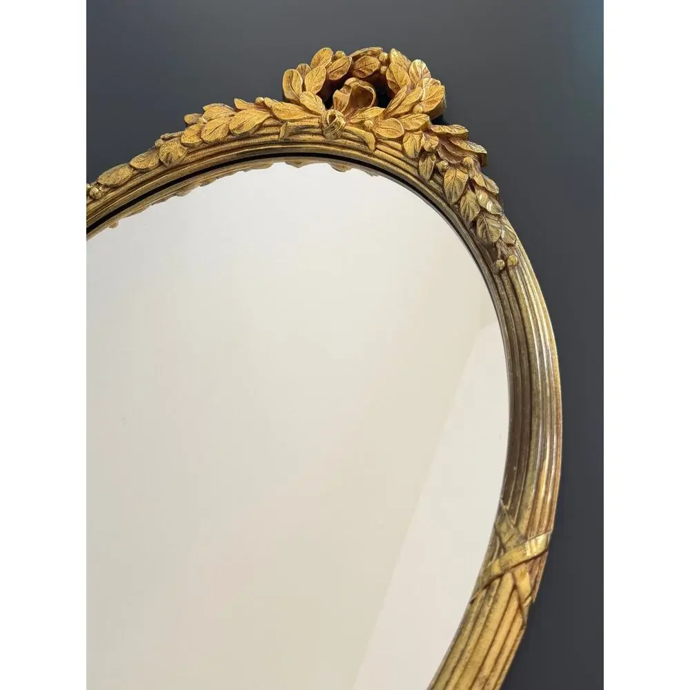 Vintage Hollywood Regency style mirror gold classic leaf wreath and ribbon crest